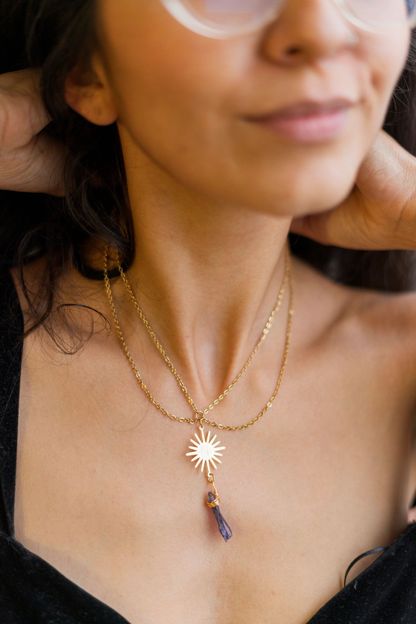 multi-layer gold necklace with iridescent charms, trendy, on white background, professional product photo