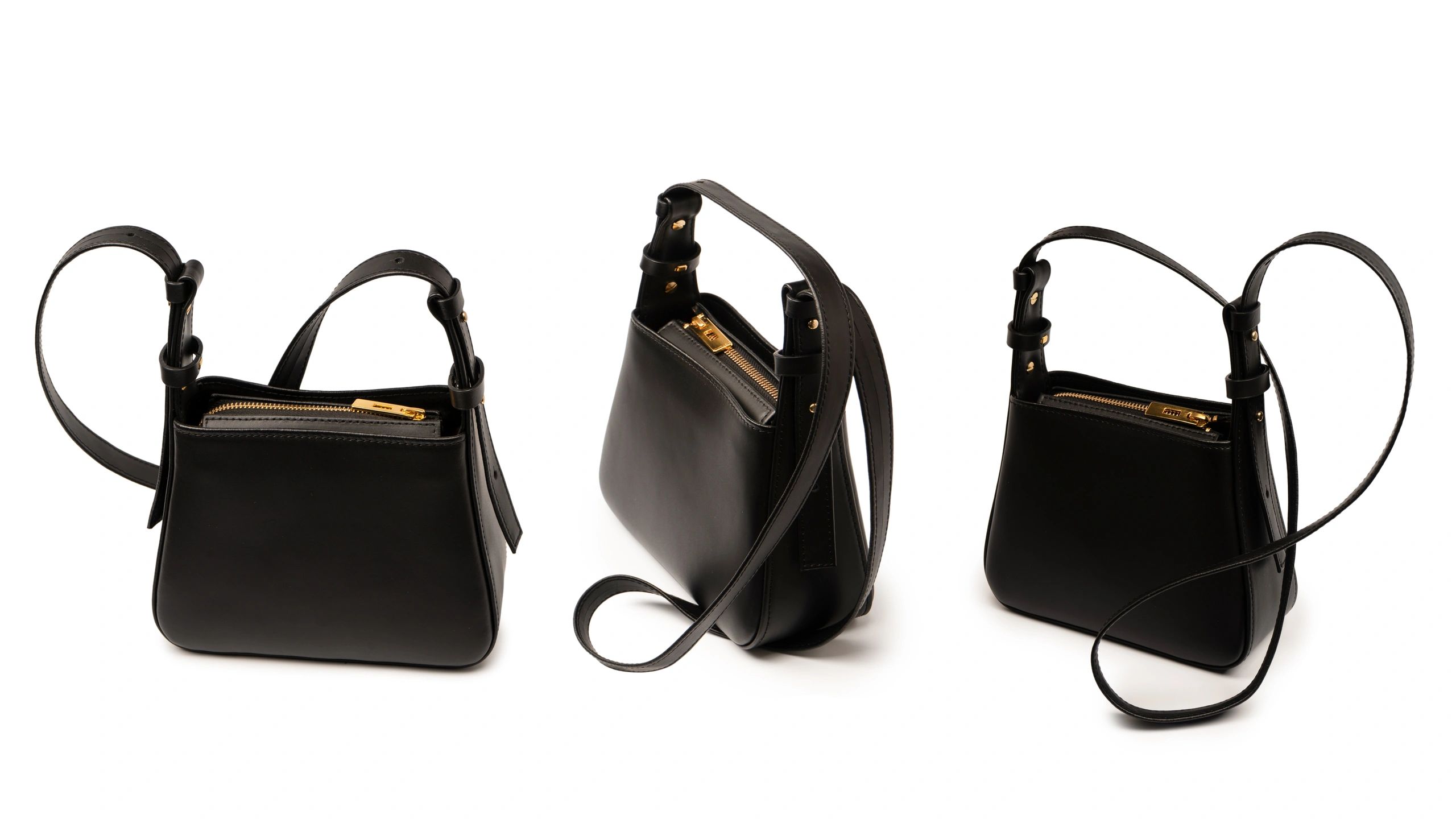 sleek black velvet tote bag with modern gold accents, studio lighting, on white background